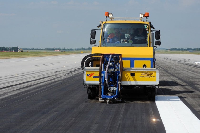 Truck clearing airport runway